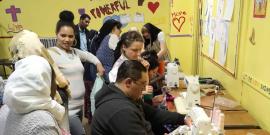 Co-op members working at sewing machines.